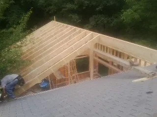 Framing a new roof addition that ties into an existing shingle roof in Herminie